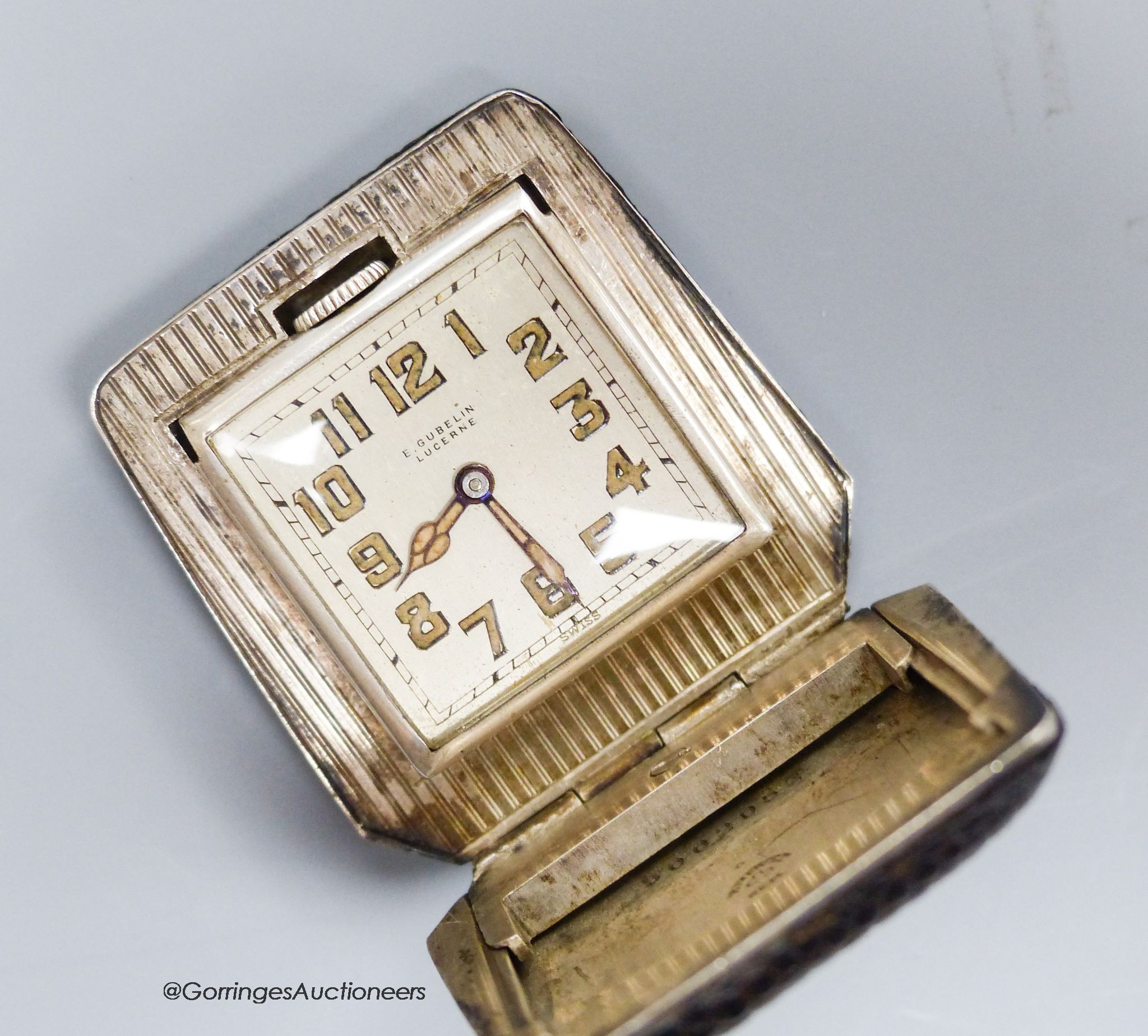 A silver Gubelin travelling watch with snakeskin outer case, signed dial and Eterna movement